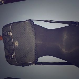 All black women’s Coach messenger bag